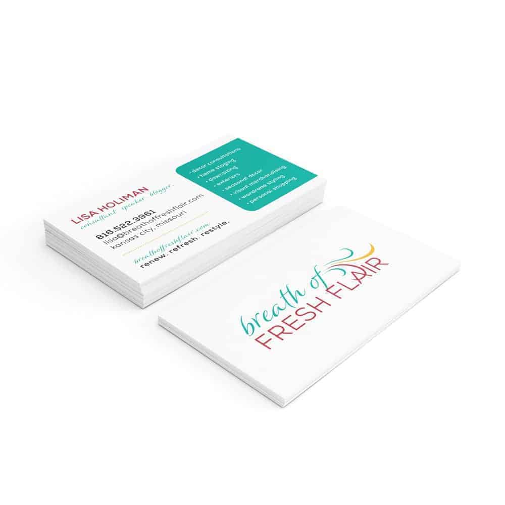 cp-mockup-bc-premium-breath-of-fresh-flair A stack of business cards, one showing contact information and the other displaying the logo "breath of FRESH FLAIR" in colorful text.
