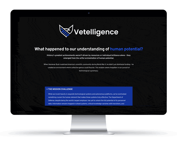 website-scrolling-mockup-Vetelligence A computer monitor displays the Vetelligence website, featuring a question about human potential and a section called "The Mission Challenge" on a dark background.